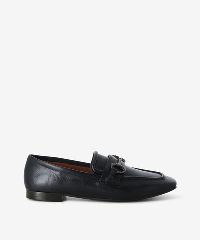 Navy leather loafers by Martini Marco. The 'WX06-2-A' is a slip on style and features a low block heel, chain embellished cross strap, and a chisel toe.
