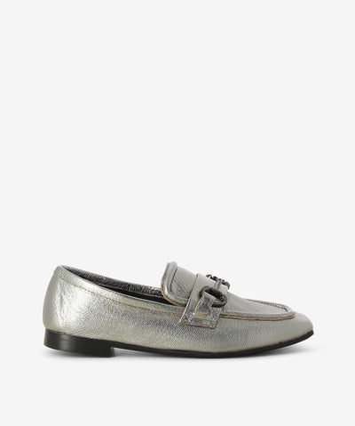 Silver metallic leather loafers by Martini Marco. It is a slip on style and features a low block heel, chain embellished cross strap, and a chisel toe.
