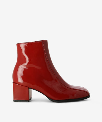 Red patent leather ankle boots with an inner zip fastening and features a high-gloss patent upper, mid heel and a soft square toe.