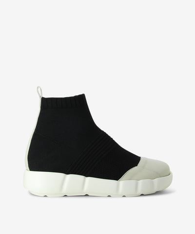 White leather sneaker boots with a pull-on style and features an elastic textile upper, contrast platform sole and a round leather toe.