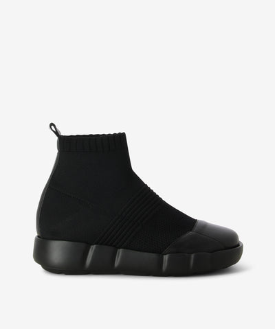 Black leather sneaker boots with a pull-on style and features an elastic textile upper, platform sole and a round leather toe.