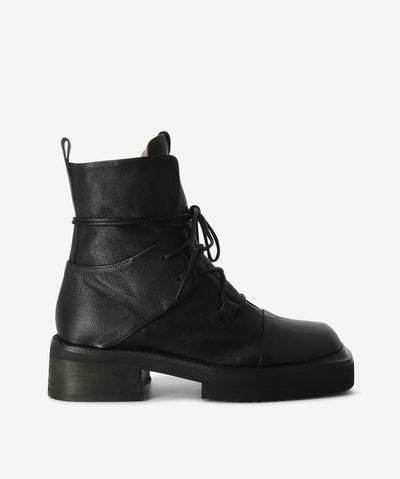 Black leather combat boots with a lace-up style and features a panelled upper, block heel, crepe sole and a square toe.