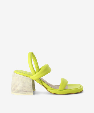 Green and white strappy leather heels by Ixos. It features an elasticated back strap, block heel, and a soft square toe.
