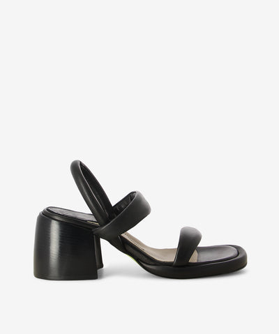 Black strappy leather heels by Ixos. It features an elasticated back strap, block heel, and a soft square toe.