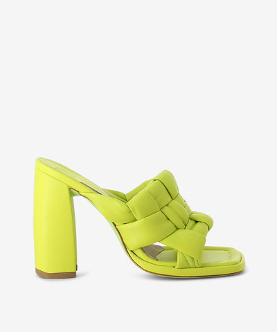 Green leather mule by Ixos. It features a thick woven upper, high block heel, and a square toe.