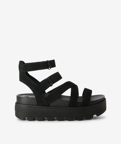 Black platform leather strappy sandals by Rollie. It has 2 adjustable velcro-fastened straps, chunky tread sole, and a round toe.