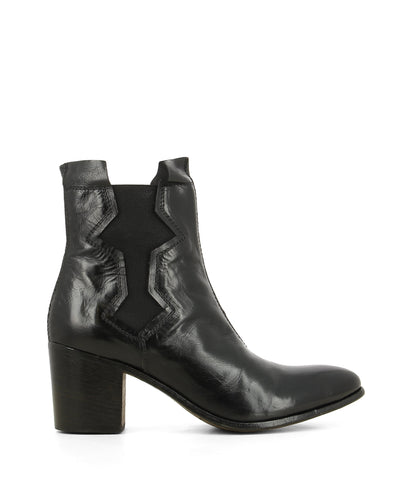 A black Italian leather Chelsea ankle boot that features a design cut out along the elastic side gussets, a 6cm block heel and an almond toe by Moma.