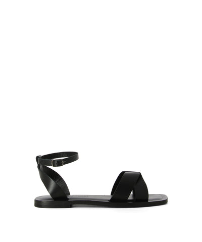 Black strappy Italian leather sandals with an ankle strap and a criss-cross leather upper, a short-stacked heel and an soft square toe by L'Artigiano Del Cuoio.