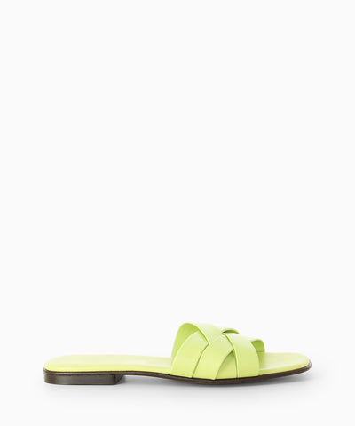 Green leather slides with a low block heel, interwoven crossover straps and a soft square toe.