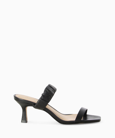 Black leather heeled sandals with a ruched top strap, kitten heel and a soft square toe.