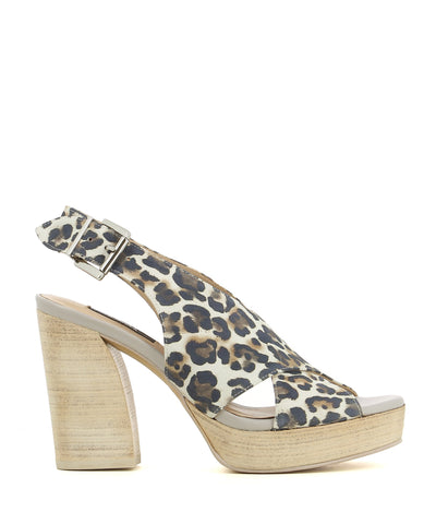 Statement leather platforms featuring a silver buckle fastening, a printed leopard print upper, a wooden platform heel and a soft almond toe by Zinda.