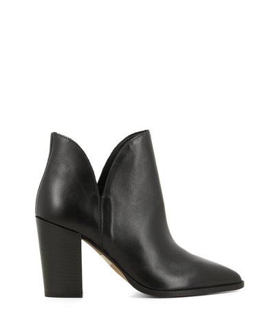 A black leather ankle boot featuring cut out sides, a tall block heel and a pointed toe by Christian Di Riccio. This style runs true to size. 
