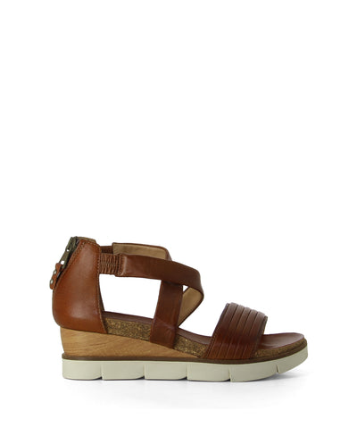 A brown leather strappy wedge platform sandal featuring cross-over leather straps with elastic for extra room, rear zip-up fastening, a wedge flatform sole and a round toe by Sempre Di by MJUS.