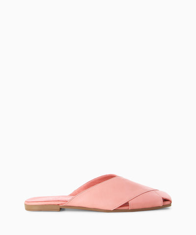 Rose leather slides with enclosed crossover straps, a low heel and a soft square toe.