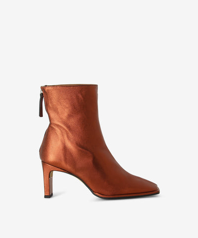 Copper leather boots with a slender heel and a pointed square toe.