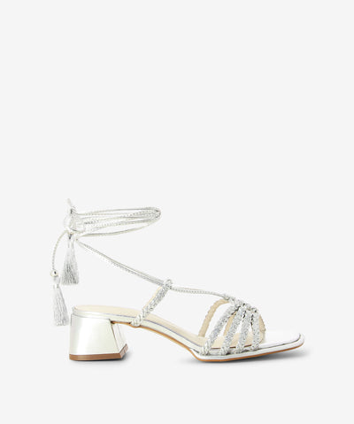 Silver leather sandals with an ankle tie fastening and featuring a braided strappy upper, tassel detail and a soft square toe.