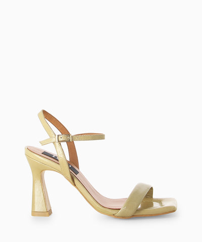 Nude leather heels with a high shine finish, slender heel and a square toe.