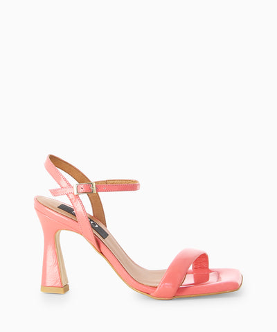 Pink leather heels with a high shine finish, slender heel and a square toe.
