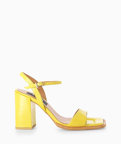 Yellow leather heeled sandals with a subtle crinkled finish, block heel and a square toe.