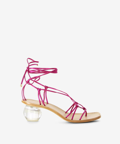 Metallic pink leather sandals with an ankle tie fastening and featuring a strappy upper, transparent orb heel and a soft square toe.