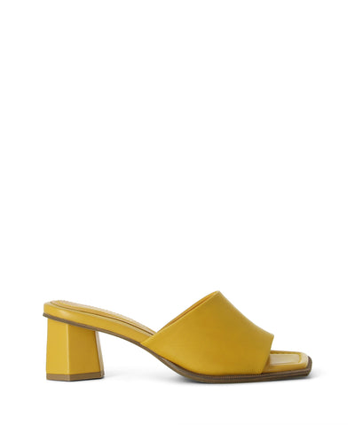 Yellow leather mules featuring a single leather strap, hexagonal heel and square toe by Bruno Premi.