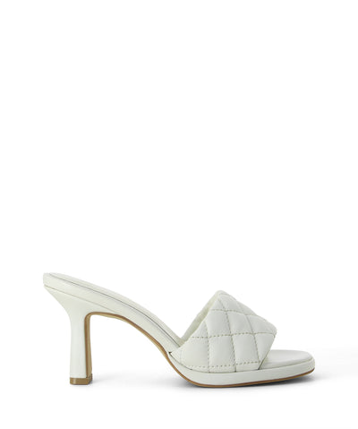 White leather mules featuring a quilted strap, offset heel and a soft square toe by Bruno Premi.