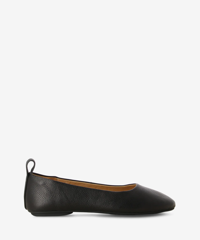 Black leather ballet flats by Rollie. It is a slip-on style and features a grained leather upper, comfortably flexible rubber outsole and a round toe.