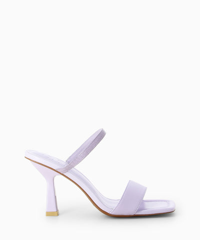 Lilac leather heels with a wider lower strap, an elasticated upper strap and a square toe.
