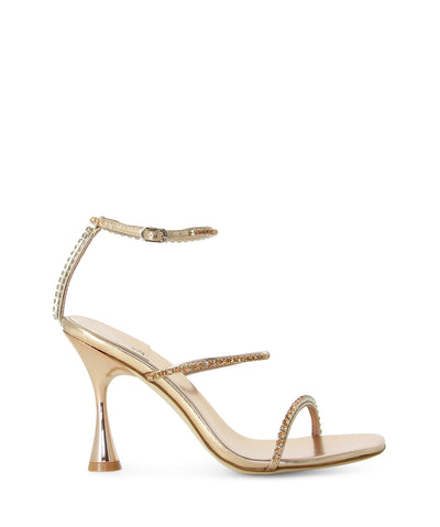 Rose gold leather strappy heeled sandals with an ankle buckle fastening, rhinestone detailing, an hourglass heel, and a square toe by Jeffrey Campbell.