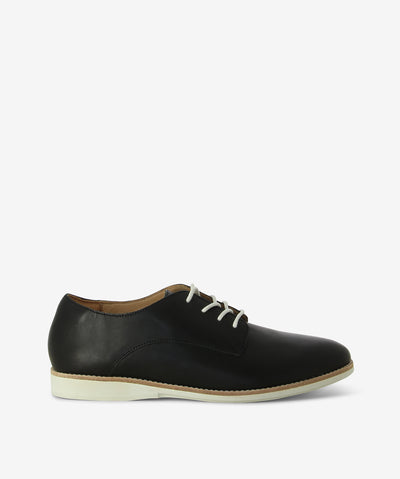 Black leather derby shoes by Rollie. It has lace-up fastening and features a round toe.