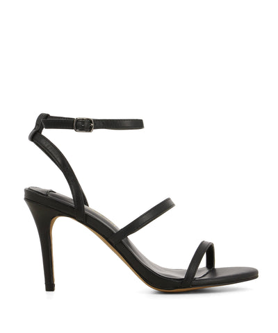 Black leather strappy heeled sandals that have a silver buckle fastening and features a 9 cm stiletto heel and a round toe by Siren.