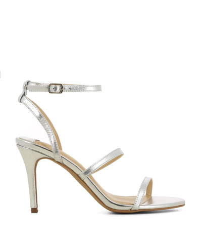 Silver leather strappy heeled sandals that have a silver buckle fastening and features a 9 cm stiletto heel and a round toe by Siren.