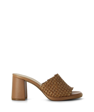 Nude leather mules featuring a woven leather upper, high block heel and an open round toe by Elvio Zanon.