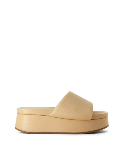 Nude leather platform slides featuring a thick padded strap, chunky platform sole and a round toe by Elvio Zanon.