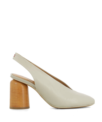 An Italian made chalk leather heeled slingback featuring a wooden cylindrical block heel and round toe – hand made in Italy by Halmanera. This style runs true to size. 