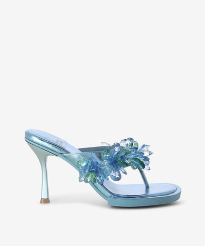 Blue metallic heels featuring a thong strap with rhinestone embellishment, a stiletto heel and a round toe by Jeffrey Campbell.