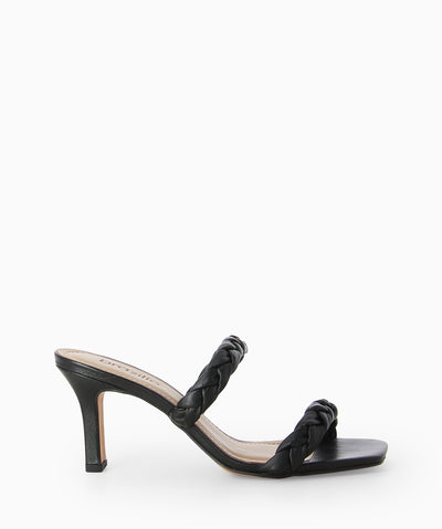 Black leather heels with two braided leather straps, a slender heel and a soft square toe.