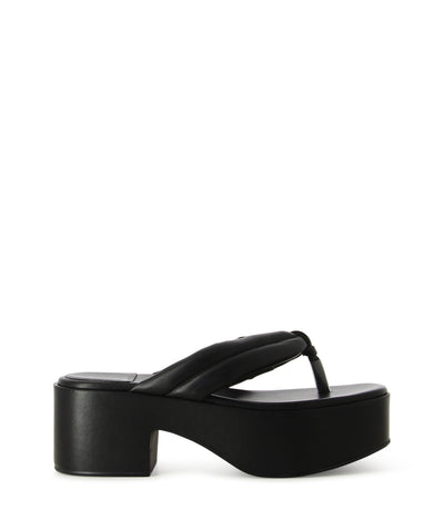 Black chunky platform thong featuring a chunky block heel, a platform sole, thick leather thong straps and a square toe by Jeffrey Campbell. 
