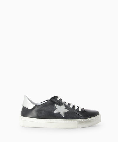Black leather sneakers with silver star detail, distressed rubber sole and a round toe.