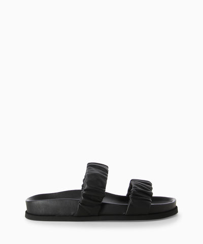 Black leather sandals with two ruched leather straps, a moulded footbed and a round toe. 