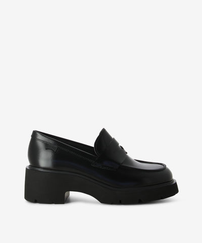 Black leather loafers with a chunky EVA sole, OrthoLite® cushioned insole and a round toe by Camper.