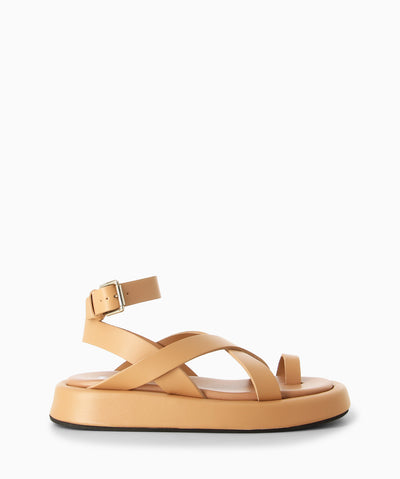 Nude leather sandals with ankle strap fastening and featuring a crossover upper, toe loop, moulded leather footbed and a soft square toe.