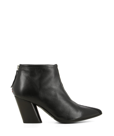 Black Italian leather ankle boots that have zipper fastening and features a center pony fur panel on the upper, a angled stylised 8cm block heel and a pointed toe by Halmanera. 