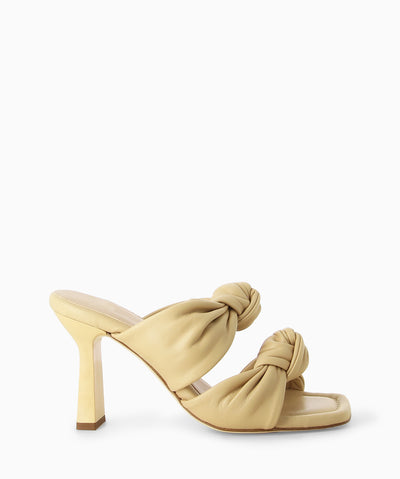 Butter leather heels with two knotted leather straps, a slender heel and a soft square toe.