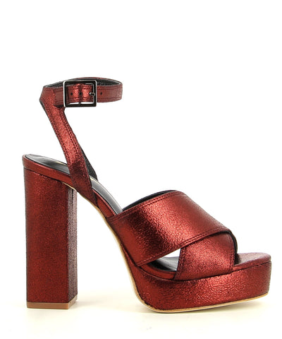 Metallic Red Dust Leather Platform Sandal featuring an ankle strap with a buckle fastening, and a round open toe. Made by ZOMP. 