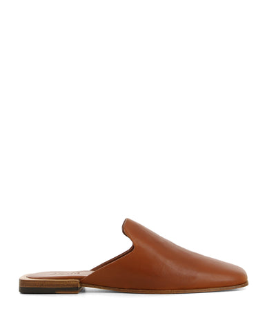 A tan leather slide that features a short square-shaped block heel, and a square toe by JVAM.