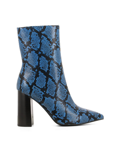 A blue and black snake skin high heel boot that features a 9cm block heel and a pointed toe by Jeffrey Campbell. This style runs true to size.