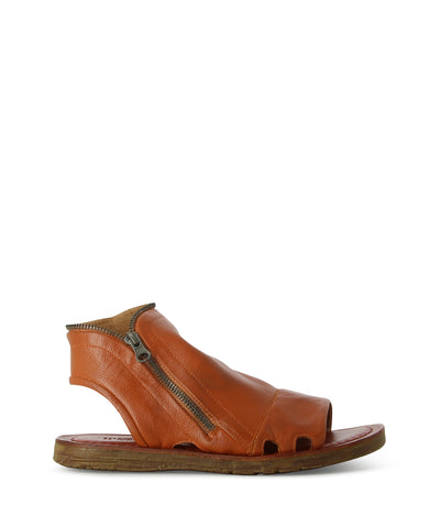 Enclosed tan sandals with an outer zipper, perforated detailing, a contrasting rubber sole, and a round toe by Martini Marco.