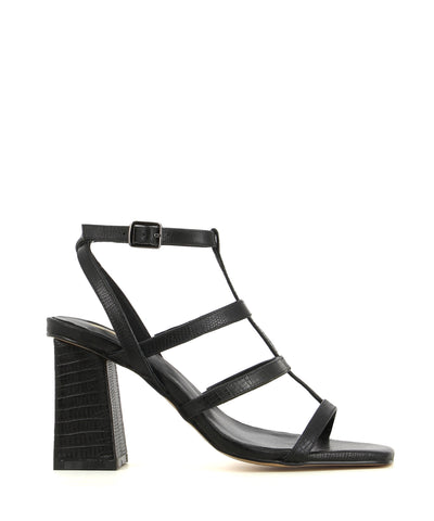 A black heeled sandal featuring a lizard look finish, a t-bar cage strap, a buckle fastenings and a square toe. Made by ZOMP. This style runs true to size.
