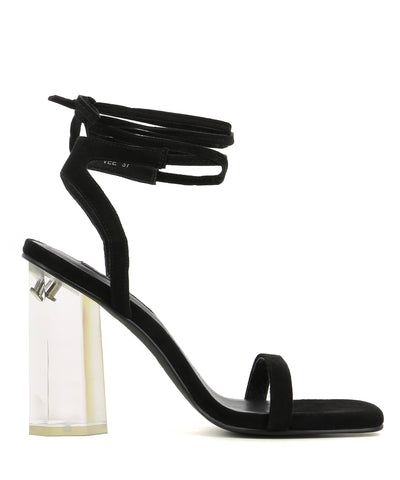 A strappy black suede sandal by Senso. The 'Vee' has a ankle wrap around tie fastening and features a clear acrylic block heel and a square toe.
